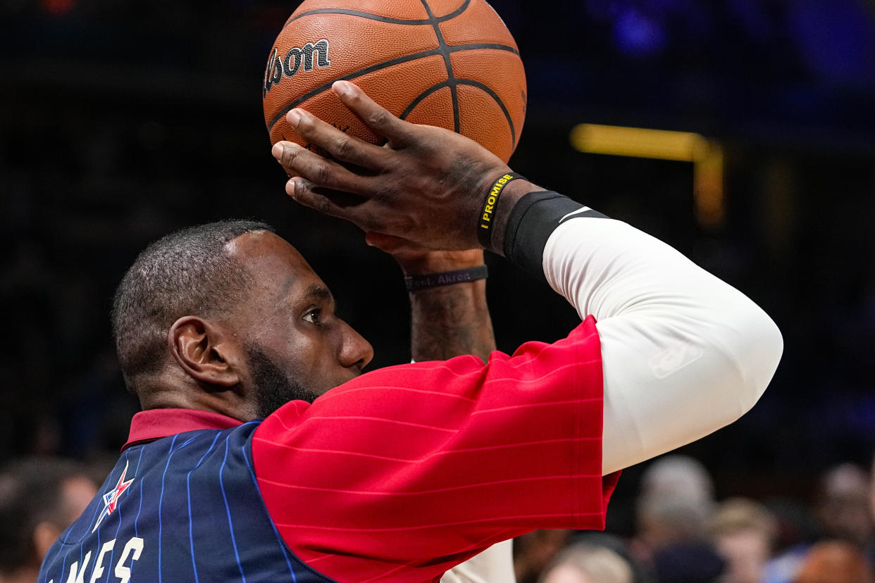 Los Angeles Lakers forward LeBron James (23) warms up before the start of the NBA All-Star basketball game in Indianapolis, Sunday, Feb. 18, 2024. (AP Photo/Darron Cummings)