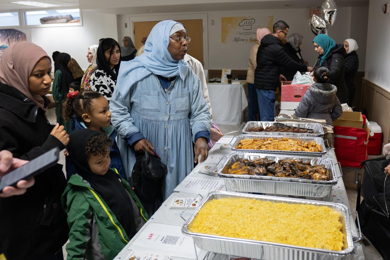 People order food during the Eid Festival held April 13 at the Worcester Islamic Center.