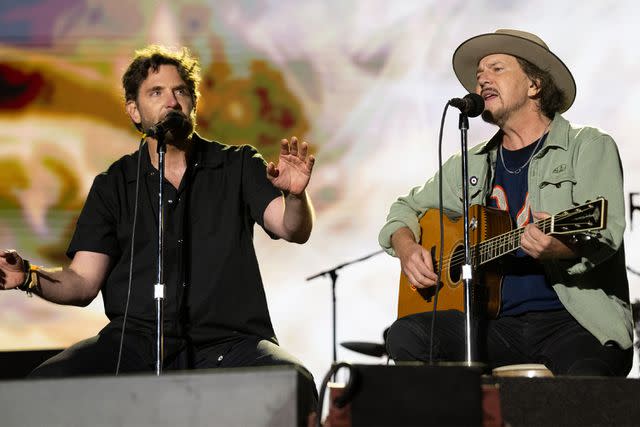 <p>Jim Bennett/Getty</p> Bradley Cooper, left, and Eddie Vedder at BottleRock Napa Valley