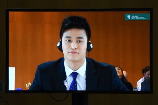 China's swimming star Sun Yang seen on a TV screen during a public hearing before the Court of Arbitration for Sport (CAS)