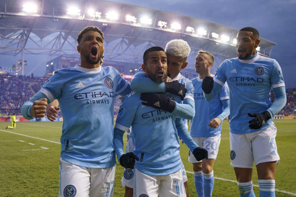 New York City FC's Maximiliano Moralez, center left, celebrates his goal with teammates during the second half of an MLS playoff soccer match against the Philadelphia Union, Sunday, Dec. 5, 2021, in Chester, Pa. (AP Photo/Chris Szagola)