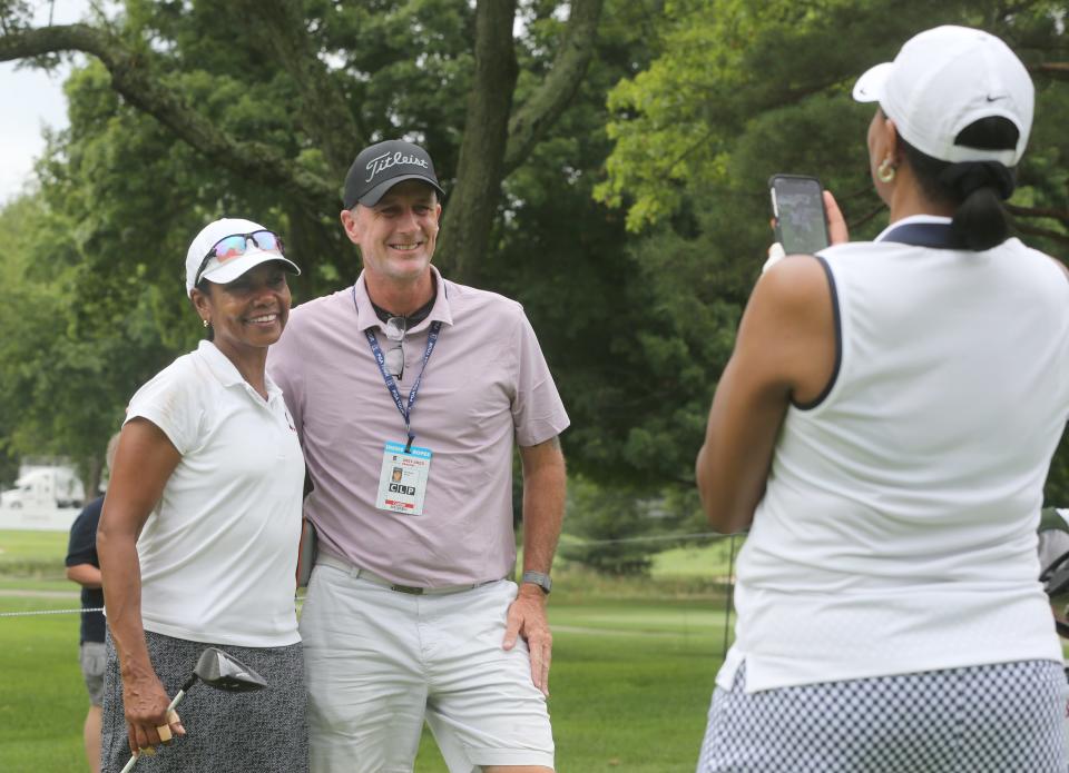 Former Secretary of State Condoleezza Rice stops for a quick photo with military veteran and Firestone caddie Michael Burns during the Bridgestone Senior Players Championship Pro-Am on Wednesday, July 6, 2022 in Akron, Ohio, at Firestone Country Club.