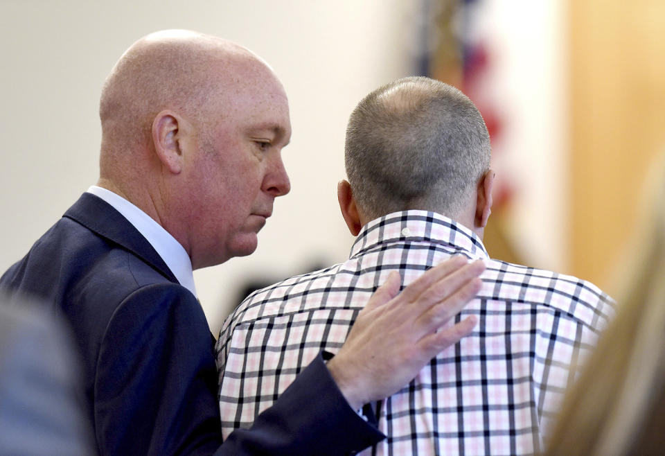 Attorney Rus Rilee, left, comforts his client, David Meehan, before Meehan took the stand in his civil trial against the Youth Development Center in his civil trial at Rockingham County Superior Court in Brentwood, N.H. on Wednesday, April 17, 2024. (David Lane/Union Leader via AP, Pool)