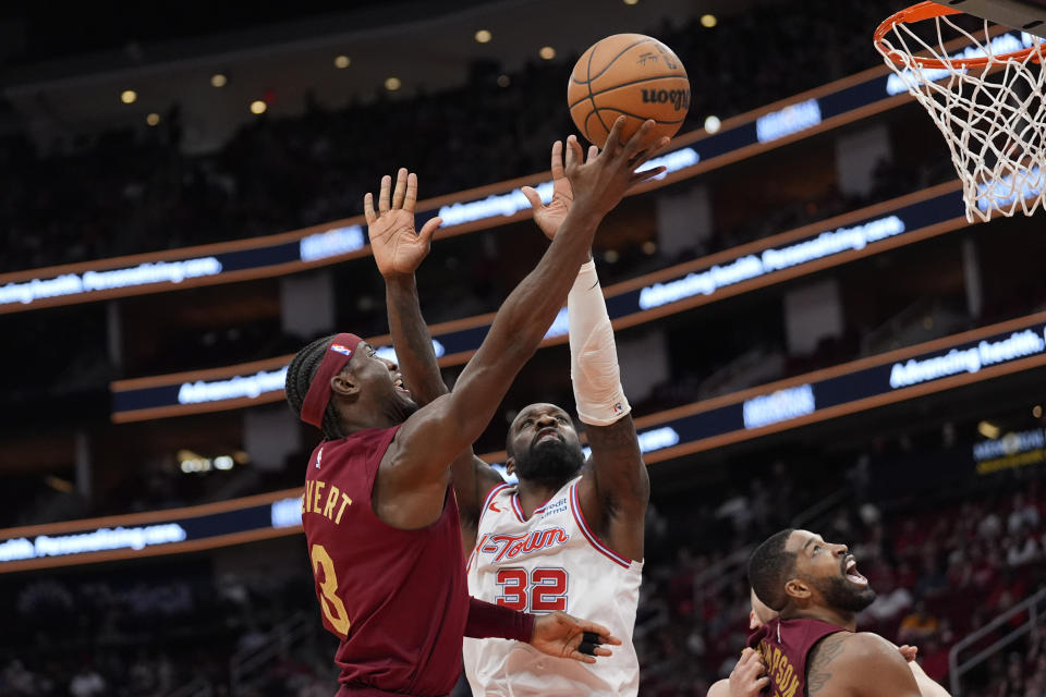 Cleveland Cavaliers' Caris LeVert (3) goes up for a shot as Houston Rockets' Jeff Green (32) defends during the first half of an NBA basketball game Saturday, March 16, 2024, in Houston. (AP Photo/David J. Phillip)