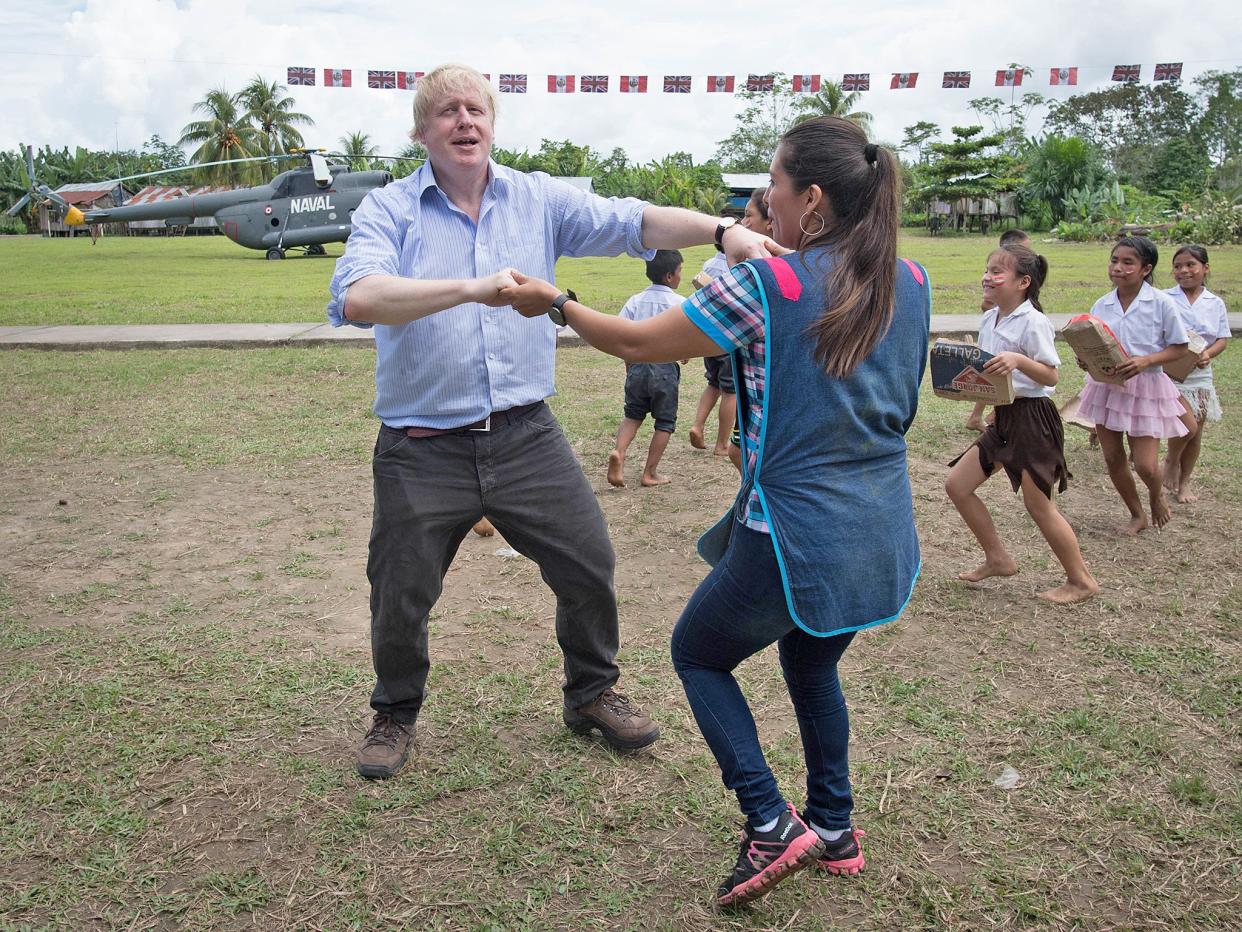 Boris Johnson spoke out on a trip to South America - where he danced with teachers and pupils: PA