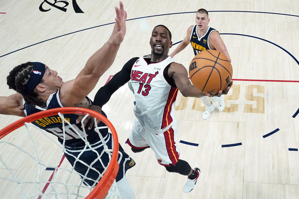 Miami Heat center Bam Adebayo to the basket against Denver Nuggets forward Aaron Gordon during Game 2 of the 2023 NBA Finals at Ball Arena in Denver on June 4, 2023. (Mark J. Terrill - Pool/Getty Images)