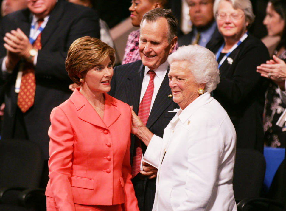 First lady Laura Bush (left) greets her in-laws, former President George H.W. Bush and Barbara Bush, at the Republican National Convention in New York on Sept. 2, 2004.