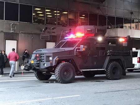 An armoured police truck occupies the street outside of the New York Port Authority in New York City, U.S. December 11, 2017 after reports of an explosion. REUTERS/Edward Tobin