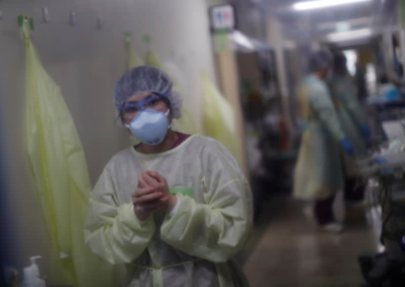 Medical workers wearing personal protective equipment (PPE) are seen inside the ICU for the coronavirus disease (COVID-19) patients at St. Marianna Medical University Hospital in Kawasaki, Japan