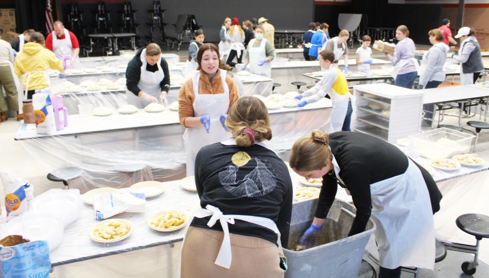 Sturgis band and orchestra students and volunteers made 1,200 apple pies on Saturday.