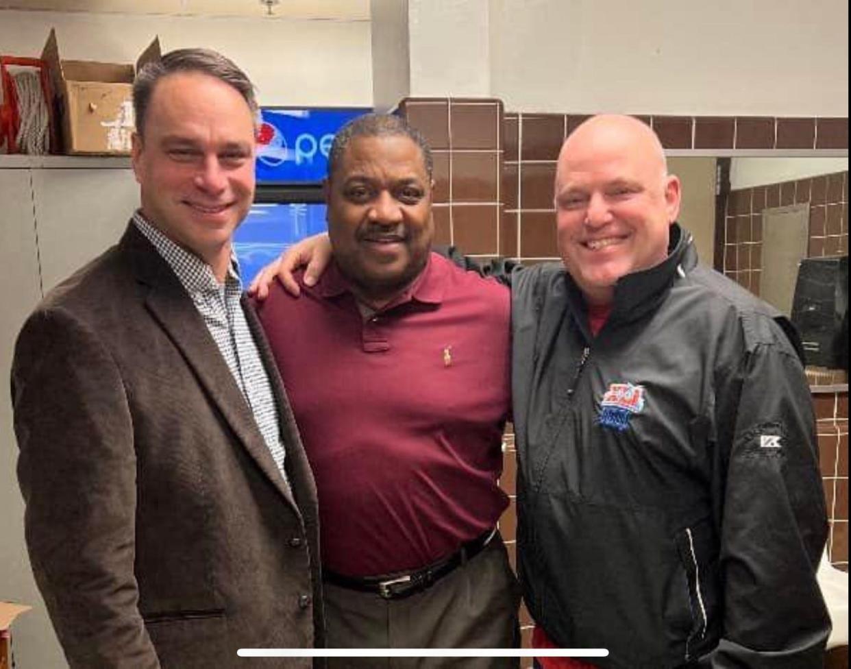Kevin Lewis (middle) before working a 2023 boys basketball game between Pike and Ben Davis. With Ken Washam (left) and Kevin Brown (right).