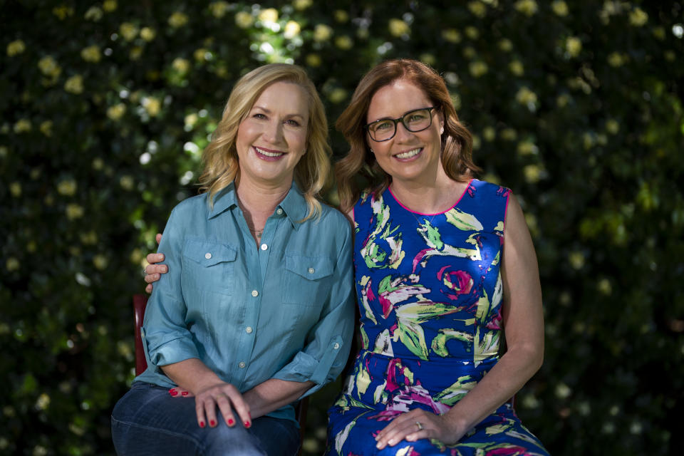 Angela Kinsey, left, and Jenna Fischer, friends and former co-stars of the comedy series "The Office" pose for photos in Glendale, Calif., Tuesday, March 22, 2022, to promote their book "The Office BFFs: Tales of The Office from Two Best Friends Who Were There." (AP Photo/Jae C. Hong)