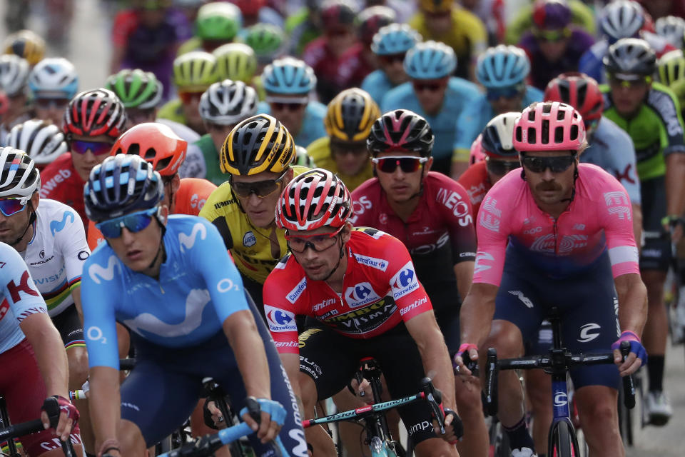 Race leader Primoz Roglic, centre, rides with the pack during the last stage of La Vuelta cycling race in Madrid, Spain, Sunday, Sept. 15, 2019. (AP Photo/Manu Fernandez)