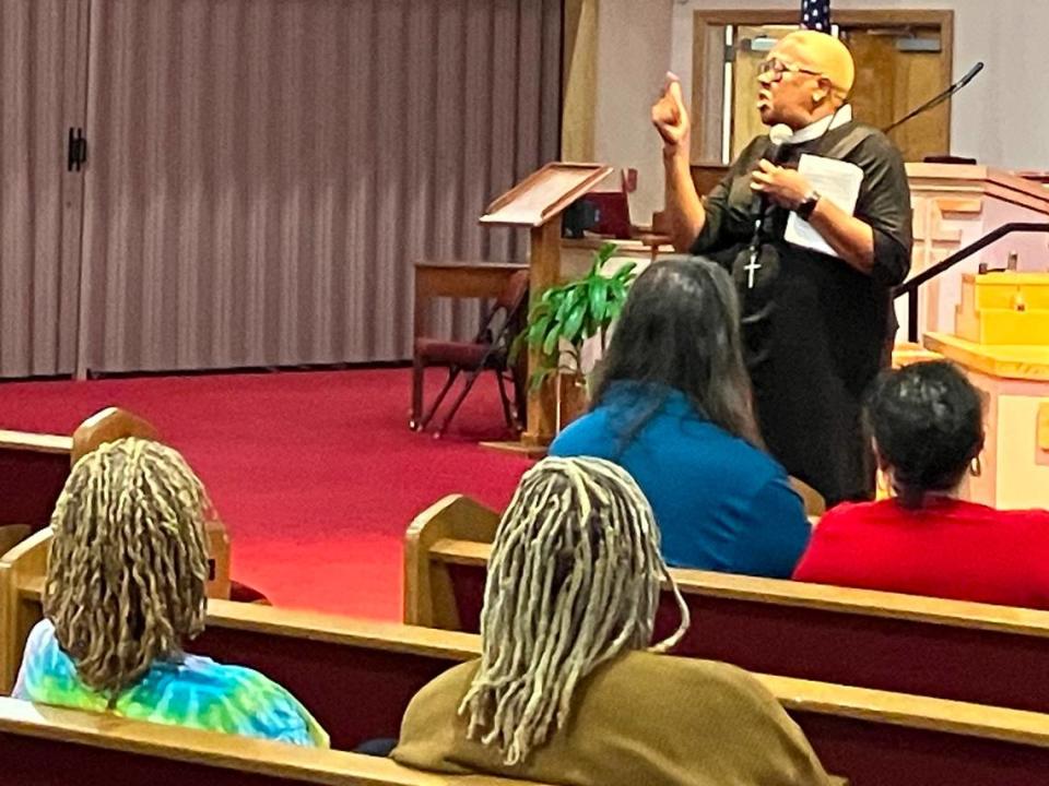 Andrea Johnson, associate pastor Kingdom Power Community Church in Columbus, speaks during a gathering of supporters for fired Central High School girls basketball coach Carolyn Wright on Aug. 8, 2023, at Franchise Missionary Baptist Church in Phenix City.