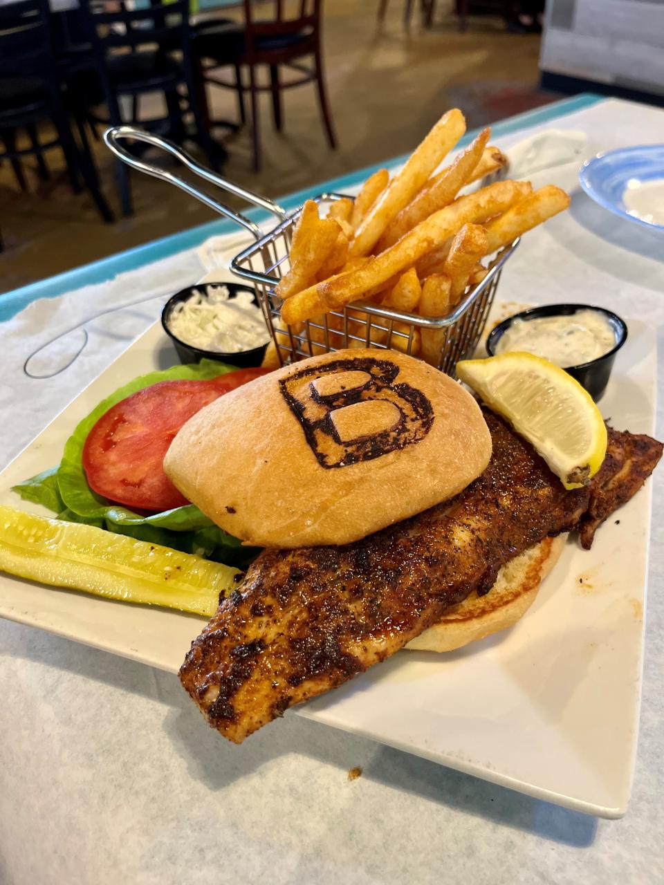 The blackened mullet sandwich at Blue Dog Bar & Grill is a half-pound of fresh, light, flaky perfection.