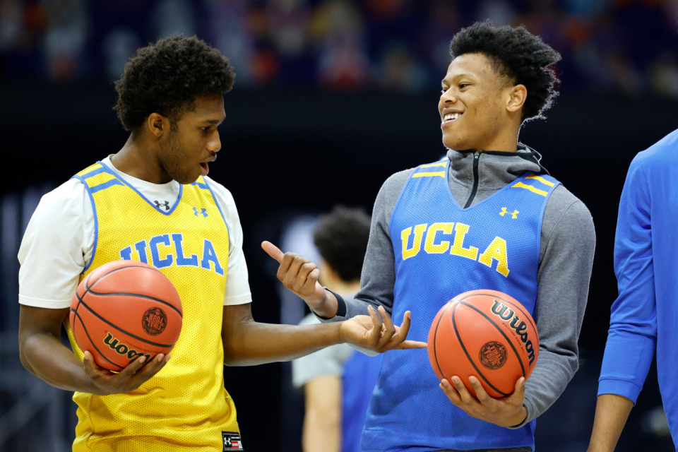 UCLA's David Singleton, left, and Jaylen Clark practice April 2, 2021, at Lucas Oil Stadium.