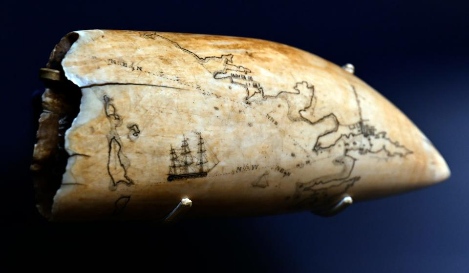 A piece of scrimshaw that is engraved with the Elizabeth Islands and Vineyard is part of the scrimshaw exhibit at the Cahoon Museum of American Art in Cotuit.