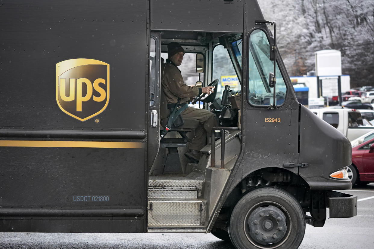 A United Parcel Service driver makes deliveries at the Mount Lebanon Shops in Mount Lebanon, Pa., Monday, Jan. 23, 2023. On Thursday, the Commerce Department issues its first of three estimates of how the U.S. economy performed in the fourth quarter of 2022.(AP Photo/Gene J. Puskar)