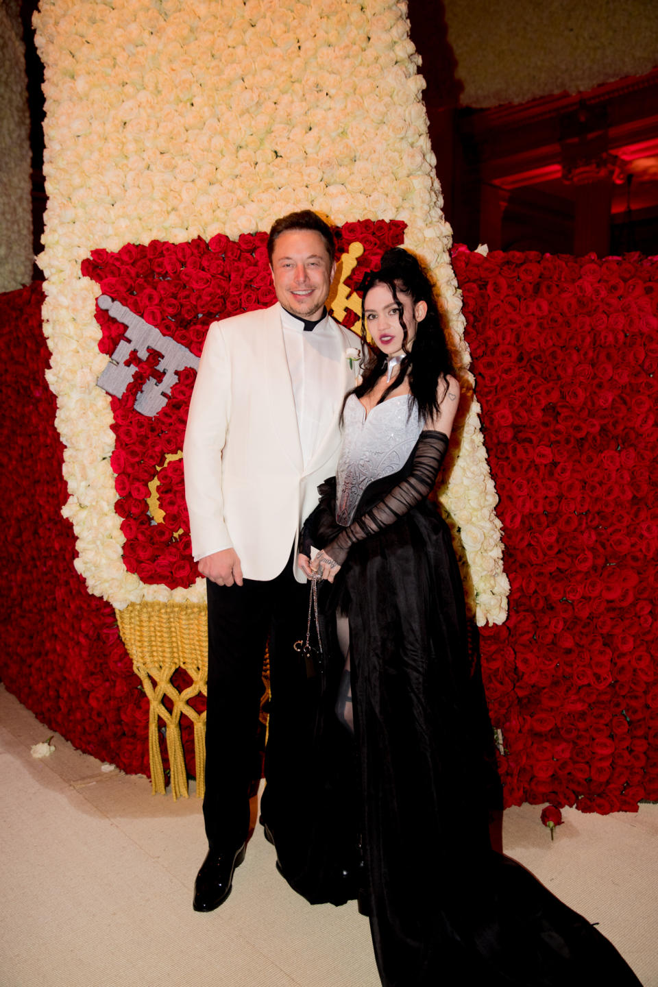NEW YORK, NY - MAY 07: Elon Musk and Grimes attend the Heavenly Bodies: Fashion & The Catholic Imagination Costume Institute Gala at The Metropolitan Museum of Art on May 7, 2018 in New York City.  (Photo by Kevin Tachman/Getty Images for Vogue)