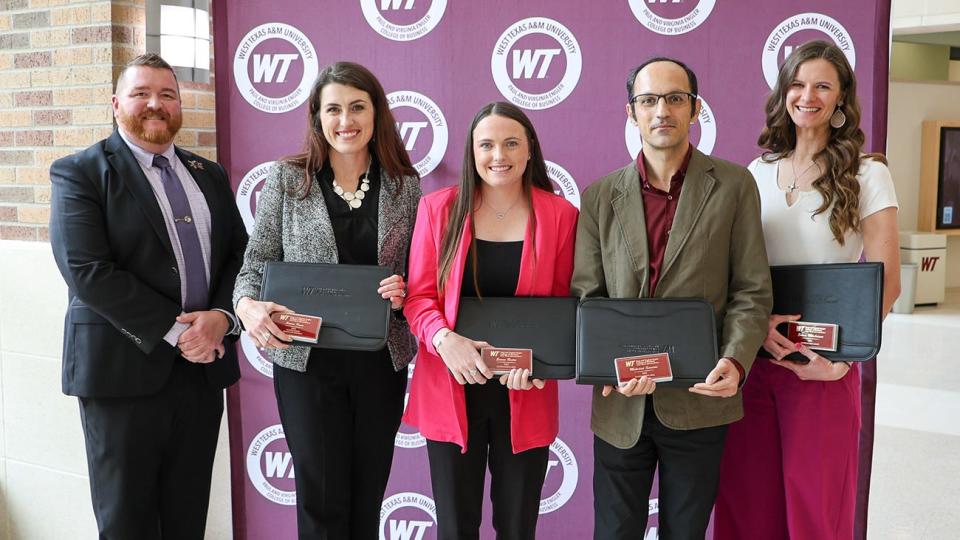West Texas A&M University's Paul and Virginia Engler College of Business recently recognized top students and community leaders at its annual symposium. Among those honored were outstanding graduate students: Sierra Kane, second from left, Emma Rector, Josh Correa and Emma Weinheimer. Also pictured is Dr. Robert Allen King, Wilder Professor of Business and associate dean of graduate business programs.