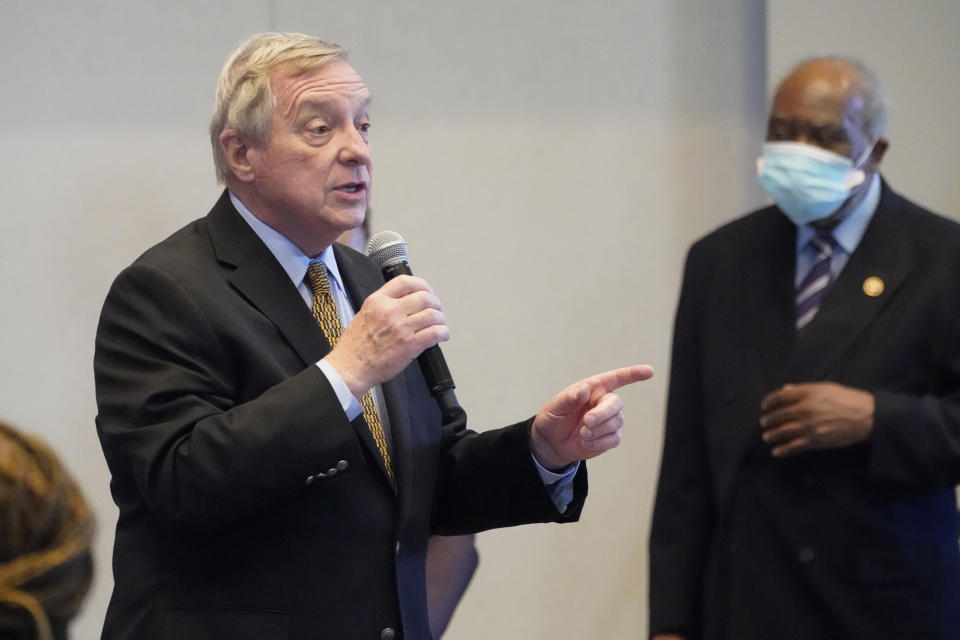 Sen. Dick Durbin, D-Ill., speaks as Rep. Danny Davis, D-Ill., listens during a visit with Vice President Kamala Harris to a COVID-19 vaccination site Tuesday, April 6, 2021, in Chicago. The site is a partnership between the City of Chicago and the Chicago Federation of Labor. (AP Photo/Jacquelyn Martin)