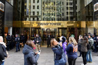 People stop to take photographs outside Trump Tower where Republican president-elect Donald Trump lives in the Manhattan borough of New York, U.S., November 27, 2016. REUTERS/Darren Ornitz