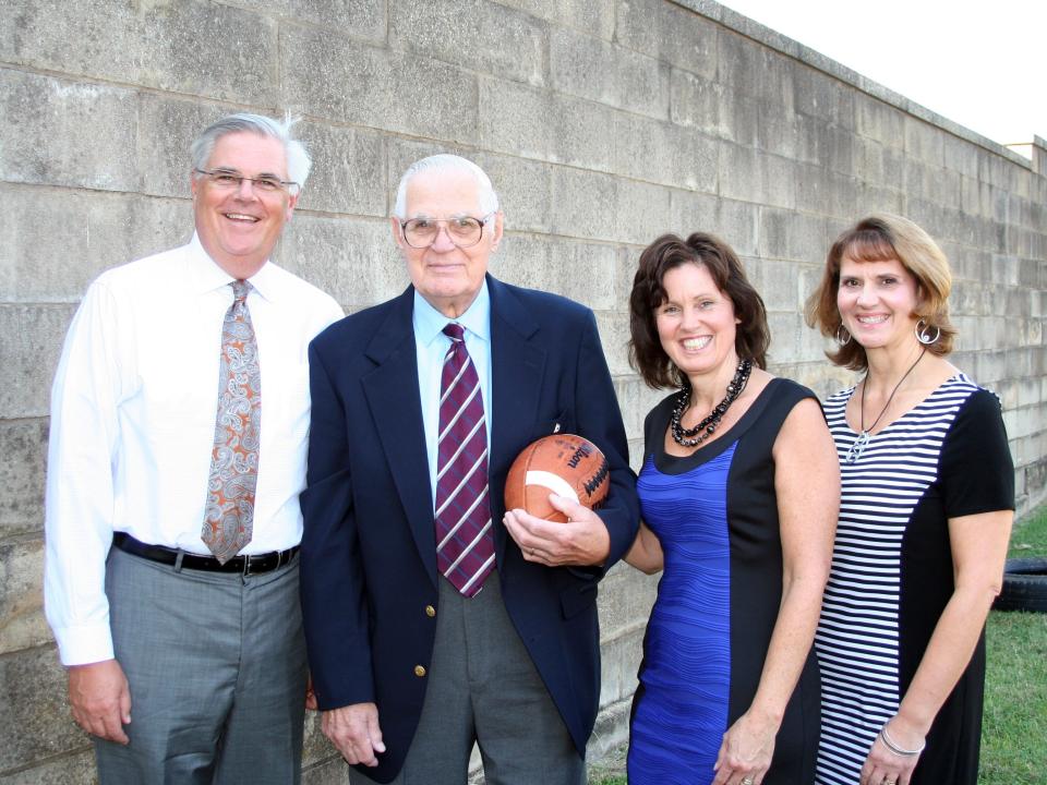 Taken in 2014 at the old football field at Parry McCluer High School where Charlie Kurtz was inducted into the school's hall of fame, Kurtz (second from left) is pictured (left to rightwith his children, Dean Kurtz, Sharon Kurtz Hanger and Kim Kurtz Uthe. All three of Kurtz's children grew up in Staunton and graduated from Lee High.