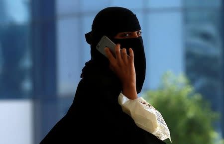 A Saudi woman speaks on the phone in Riyadh, Saudi Arabia October 2, 2017. REUTERS/Faisal Al Nasser/Files