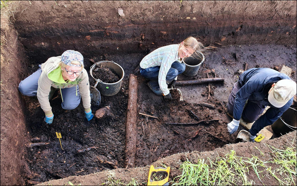 Archaeologists work at an excavation site in Finland. (Satu Koivisto)