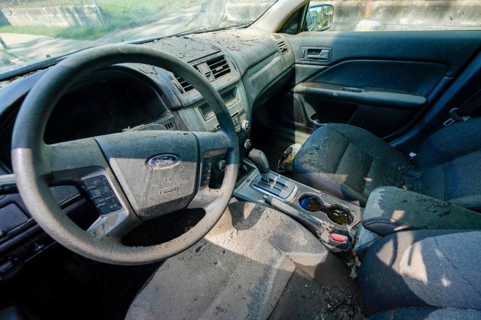 The interior of a car damaged by the flood is seen covered in mud, Friday, Sept. 3, 2021, in Mamaroneck, N.Y. More than three days after the hurricane blew ashore in Louisiana, Ida’s rainy remains hit the Northeast with stunning fury on Wednesday and Thursday, submerging cars, swamping subway stations and basement apartments and drowning scores of people in five states. (AP Photo/Mary Altaffer)