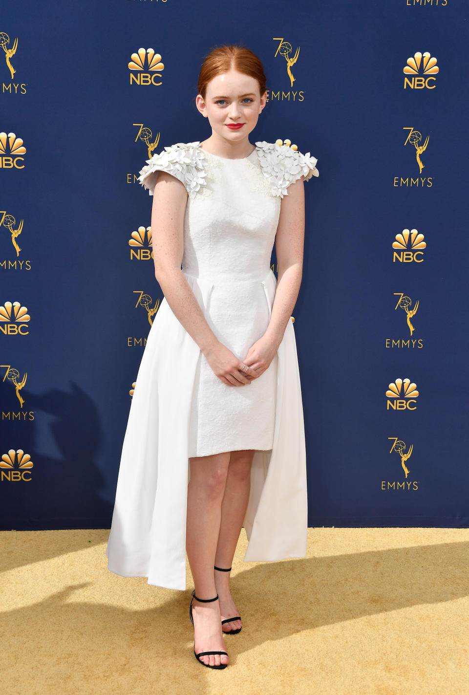 <p>The <em>Stranger Things</em> actress was one of many of her co-stars wearing all white, in a custom Hiraeth dress. (Photo: Getty Images) </p>