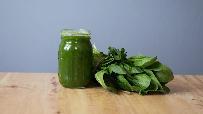 green juice with spinach bunch