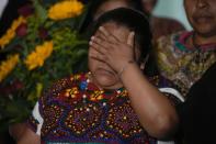 Guatemalan migrant Juana Alonso Santizo arrives at La Aurora international airport in Guatemala City, Sunday, May 22, 2022. Alonso Santizo who was imprisoned in northeastern Mexico for seven years while trying to migrate to the United States and who was arrested on kidnapping charges was released on Saturday, May 21, after numerous organizations and even Mexican President Andres Manuel Lopez Obrador interceded on her behalf. (AP Photo/Moises Castillo)