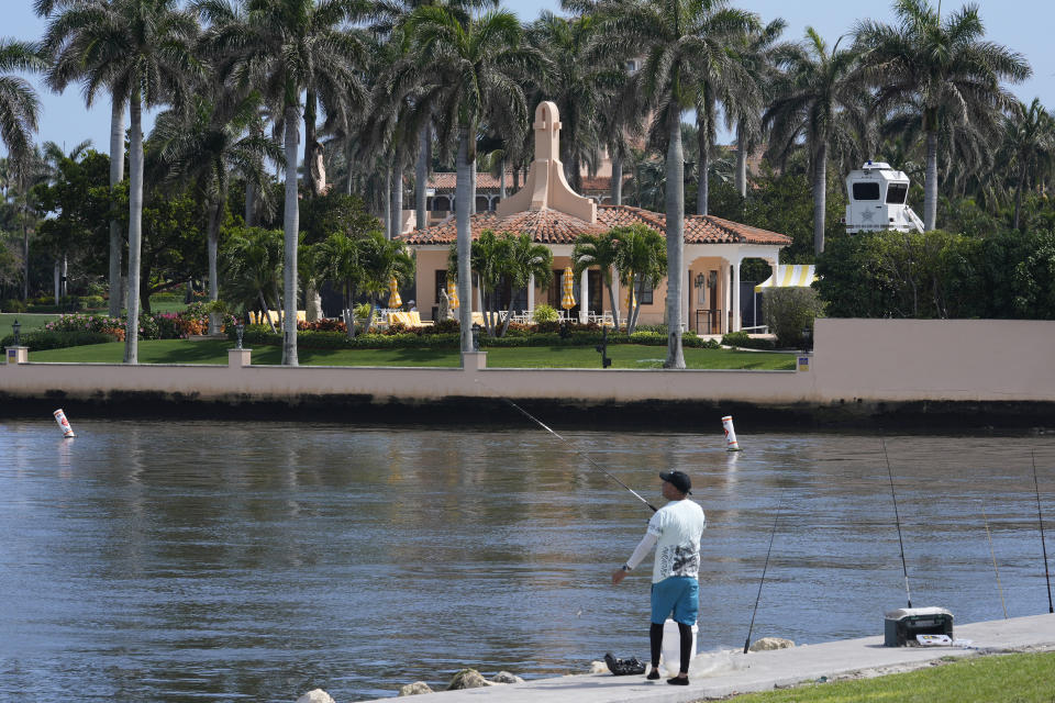 A fisherman casts a line near Mar-a-Lago, as former President Donald Trump is planning to meet Hungarian Prime Minister Victor Orban, Friday, March 8, 2024, in Palm Beach, Fla. (AP Photo/Marta Lavandier)