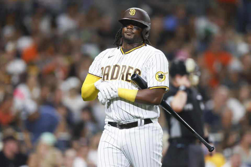 San Diego Padres' Josh Bell walks to the dugout after striking out against the San Francisco Giants during the fouth inning of a baseball game Monday, Aug. 8, 2022, in San Diego. (AP Photo/Mike McGinnis)