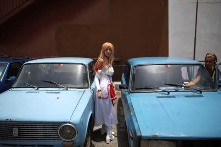 Massiel Alvarez, 18, enters a car at the end of the Cuban Otaku festival in Havana, Cuba, July 24, 2016. REUTERS/Alexandre Meneghini