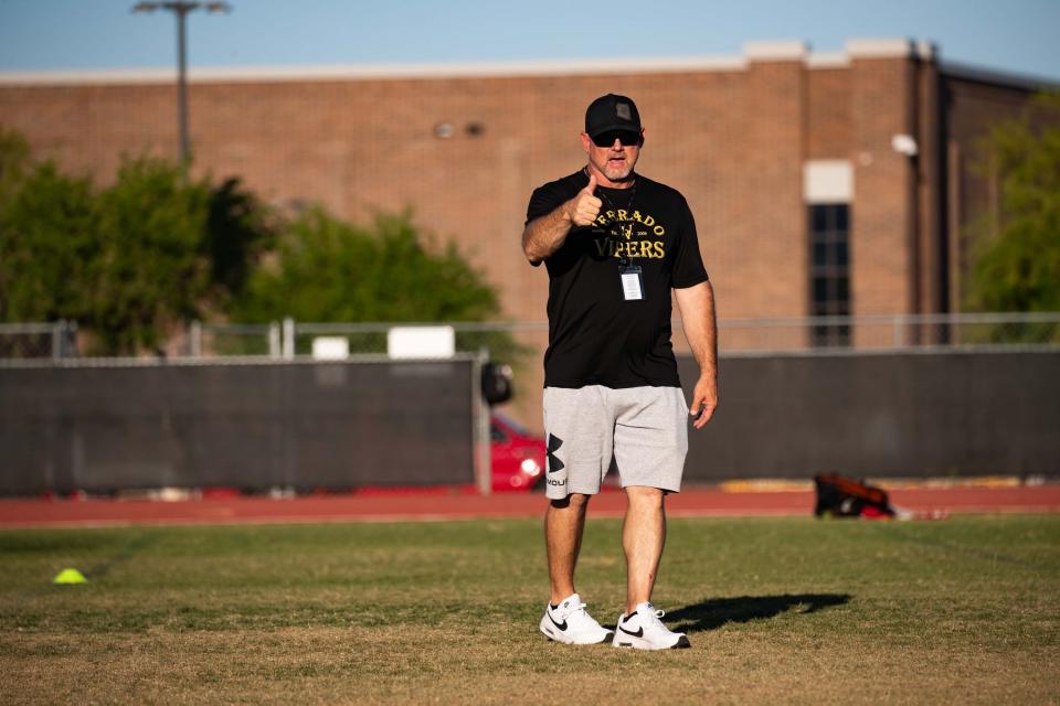 Apr 29, 2024; Buckeye, Ariz., U.S.; Verrado Vipers Coach Jeremy Hathcock guides players through drills during practice at Verrado High SchoolÕs football field in Buckeye on April 29, 2024.