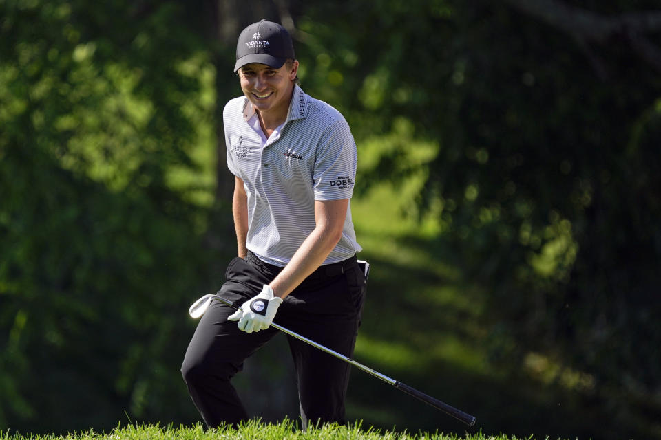 FILE - In this June 4, 2021, file photo, Carlos Ortiz, of Mexico, smiles as he walks to the 18th green during the second round of the Memorial golf tournament in Dublin, Ohio. Carlos and his brother Alvaro will be playing in their first major together at the U.S. Open next week at Torrey Pines in San Diego.(AP Photo/Darron Cummings)