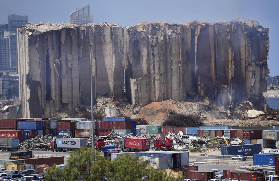 Smoke rises from the north block silos which was damaged during August 2020 Beirut's massive explosion, in Beirut, Lebanon, Thursday, July 28, 2022. Emmanuel Durand, a French civil engineer who volunteered for the Lebanese government-commissioned team of experts says it is inevitable that the north block going to collapse. It's only just a matter of time. (AP Photo/Hussein Malla)