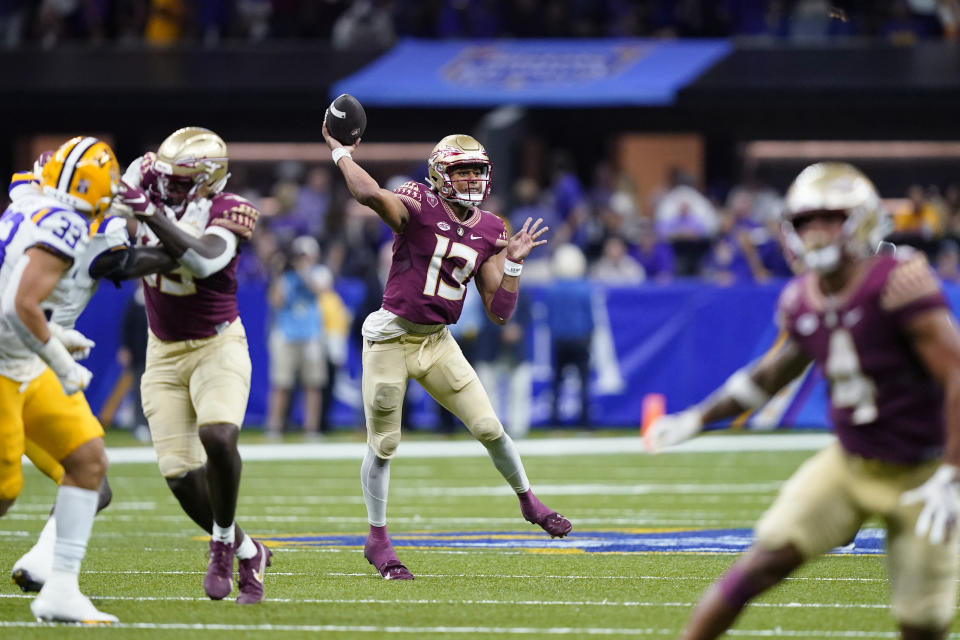 Florida State quarterback Jordan Travis (13) passes in the second half of an NCAA college football game against LSU in New Orleans, Sunday, Sept. 4, 2022. Florida State won 24-23. (AP Photo/Gerald Herbert)