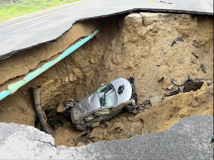 Two vehicles swallowed by a sinkhole on Iverson Road in Chatsworth are shown in this January 2023 photo provided by Caltrans.