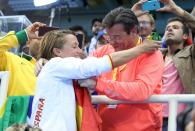 <p>Gold medalist Mireia Belmonte of Spain with her father Jose Belmonte following the Women’s 200m Butterfly Final on day 5 of the Rio 2016 Olympic Games at Olympic Aquatics Stadium on August 10, 2016 in Rio de Janeiro, Brazil. (Photo by Jean Catuffe/Getty Images) </p>