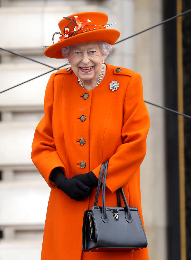 Queen Elizabeth II's iconic fashion revealed, from her brightly colored  dresses to her signature handbag