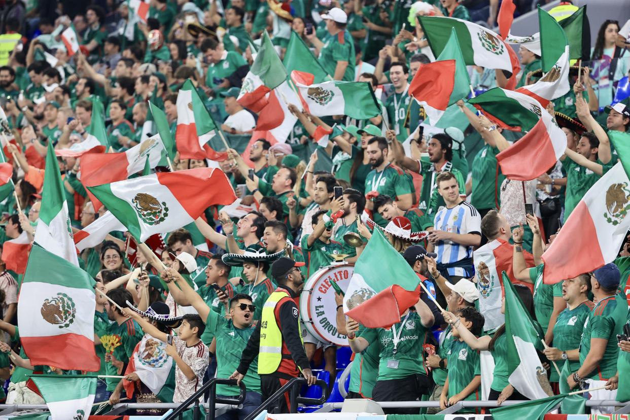 DOHA, QATAR - NOVEMBER 22: Fans of Mexico cheer at tribune during the FIFA World Cup Qatar 2022 Group C match between Mexico and Poland at Stadium 974 on November 22, 2022 in Doha, Qatar. (Photo by Mohammed Dabbous/Anadolu Agency via Getty Images)