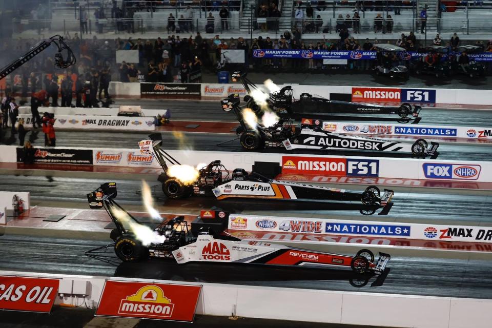 a group of race cars on a track