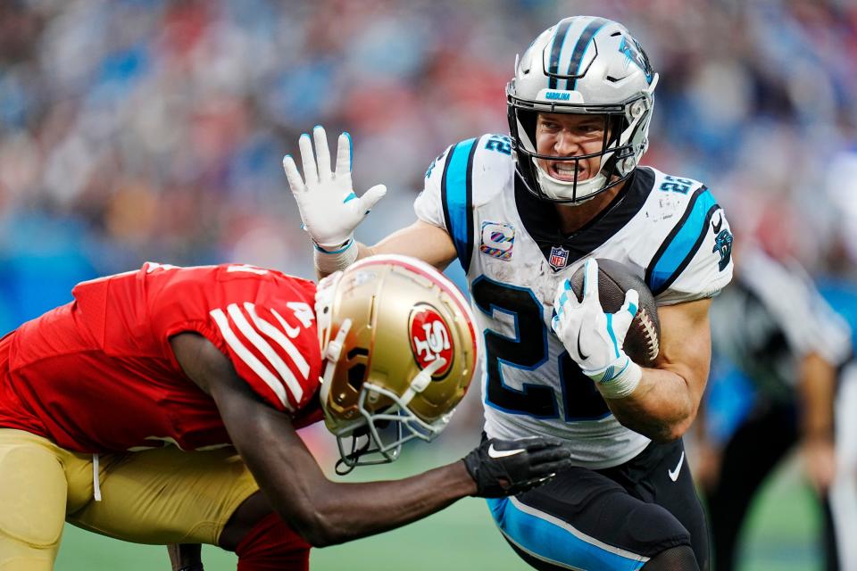 Carolina Panthers running back Christian McCaffrey runs past San Francisco 49ers cornerback Emmanuel Moseley during the second half an NFL football game on Sunday, Oct. 9, 2022, in Charlotte, N.C. (AP Photo/Rusty Jones)