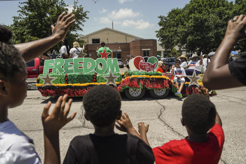 Spectators watch a Juneteenth Parade commemorating the end of slavery in the United States on June 19, 2021 in Galveston, Texas. / Credit: Go Nakamura / Getty Images