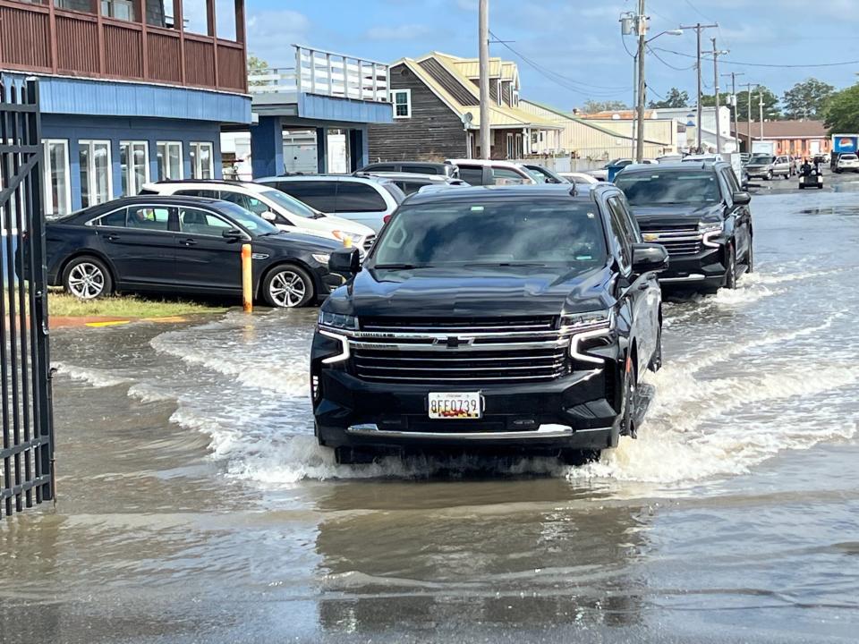 The convoy carrying Maryland Gov. Wes Moore and Lt. Gov. Aruna Miller makes its way toward the 46th annual J. Millard Tawes Crab & Clam Bake on Wednesday, Sept. 27, at Somers Cove Marina in Crisfield.