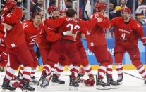 Ice Hockey - Pyeongchang 2018 Winter Olympics - Men's Final Match - Russia - Germany - Gangneung Hockey Centre, Gangneung, South Korea - February 25, 2018 - Olympic Athlete from Russia Kirill Kaprizov reacts with teammates after scoring a goal. REUTERS/Kim Kyung-Hoon