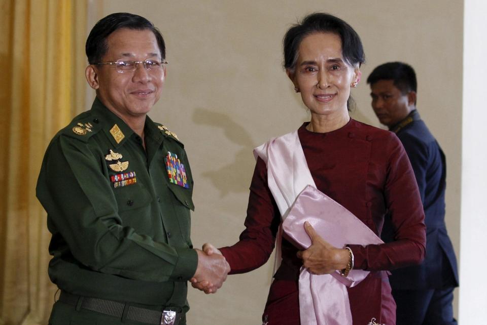 Senior General Min Aung Hlaing, Myanmar's commander-in-chief, with National League for Democracy party leader Aung San Suu Kyi before their meeting in Hlaing's office at Naypyitaw in 2015 - REUTERS/Soe Zeya Tun